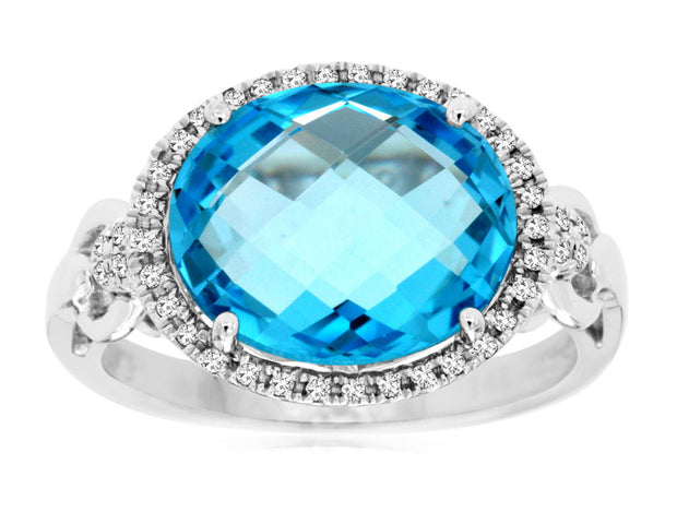 Oval Blue Topaz and Diamond Ring in 14 kt White Gold