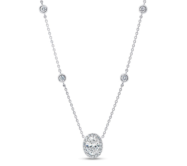 Oval Diamond Pendant with Diamond Stations in 18 kt White Gold